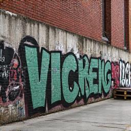 Graffiti-covered wall in a warehouse district ideal for skating